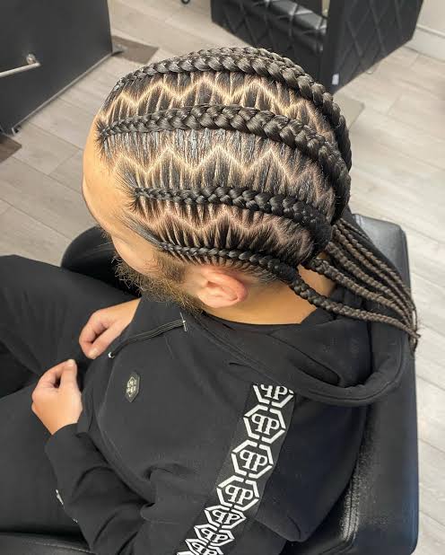 Zigzag-parted feed-in cornrows braided straight back for a male client at Ani Braids in Lanham, Maryland