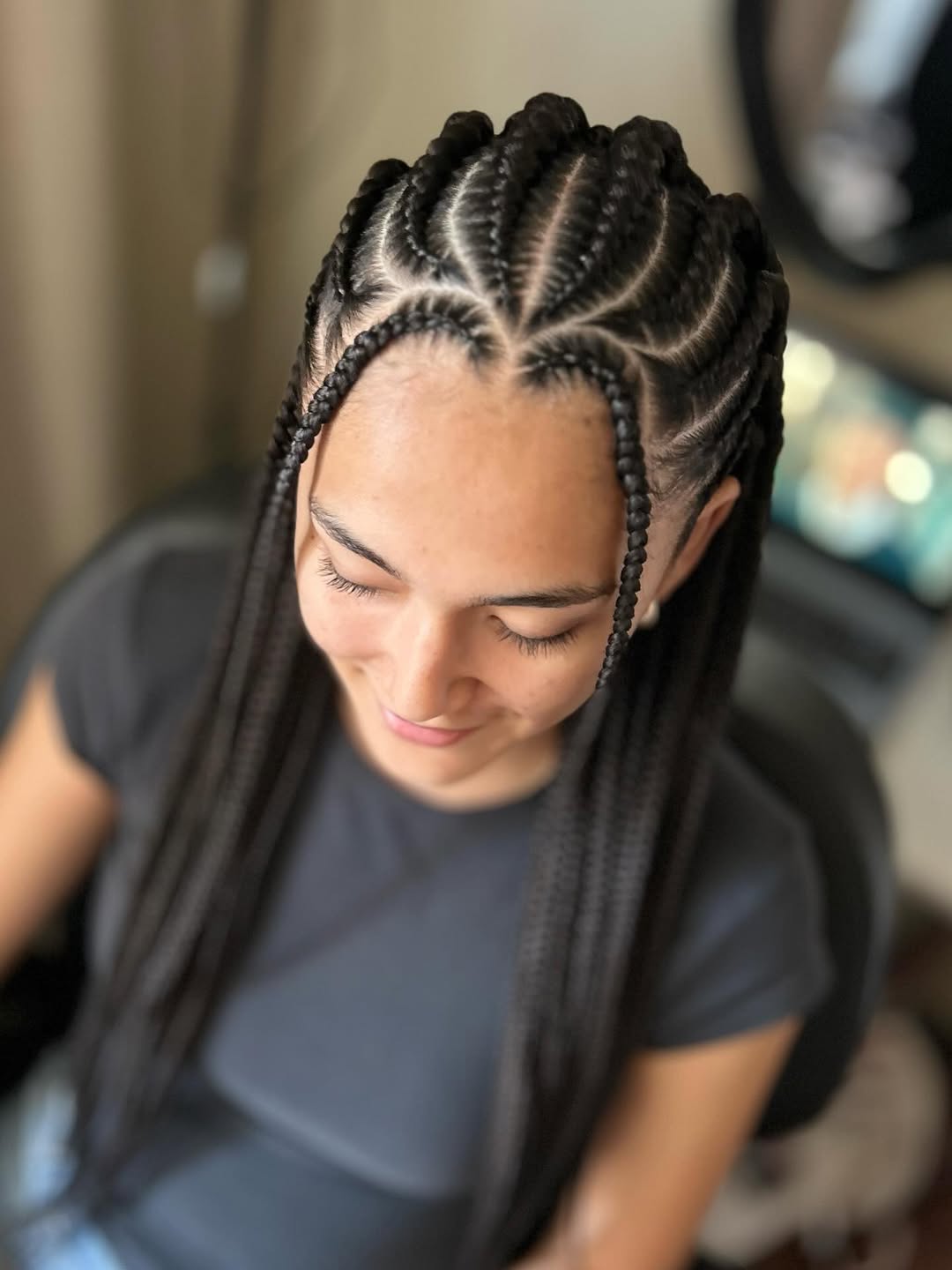 Cornrows with long black individual braids by Ani Braids in Lanham, Maryland