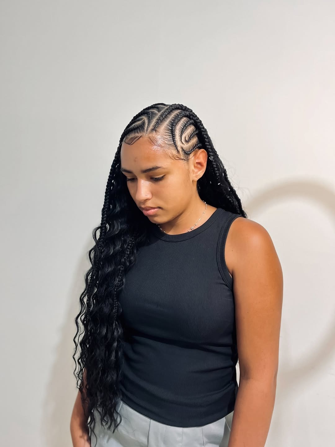 Black knotless boho cornrows with long wavy ends by Ani Braids in Lanham, Maryland