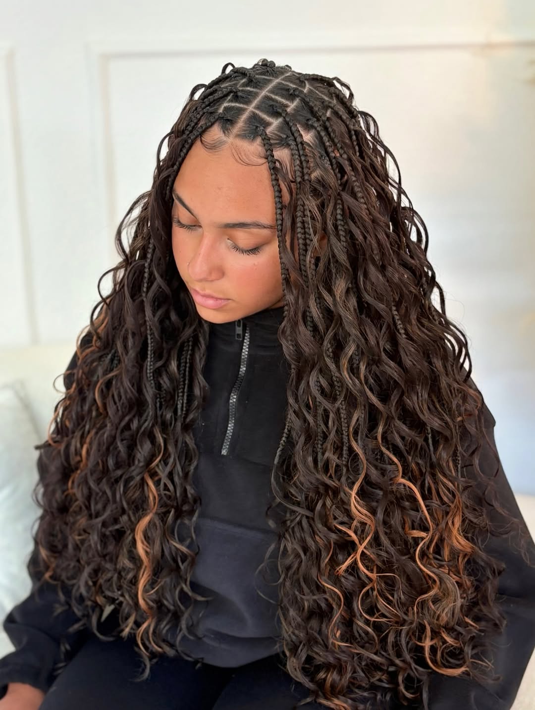 Long dark boho braids with wavy ends and light brown highlights by Ani Braids in Lanham, Maryland