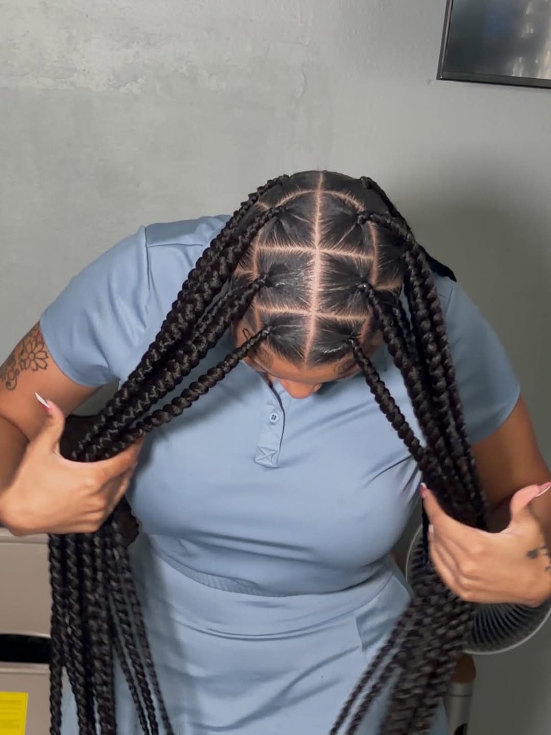 Top-down view of chunky knotless braids showing neat square parting across the scalp, installed at Ani Braids in Lanham, Maryland