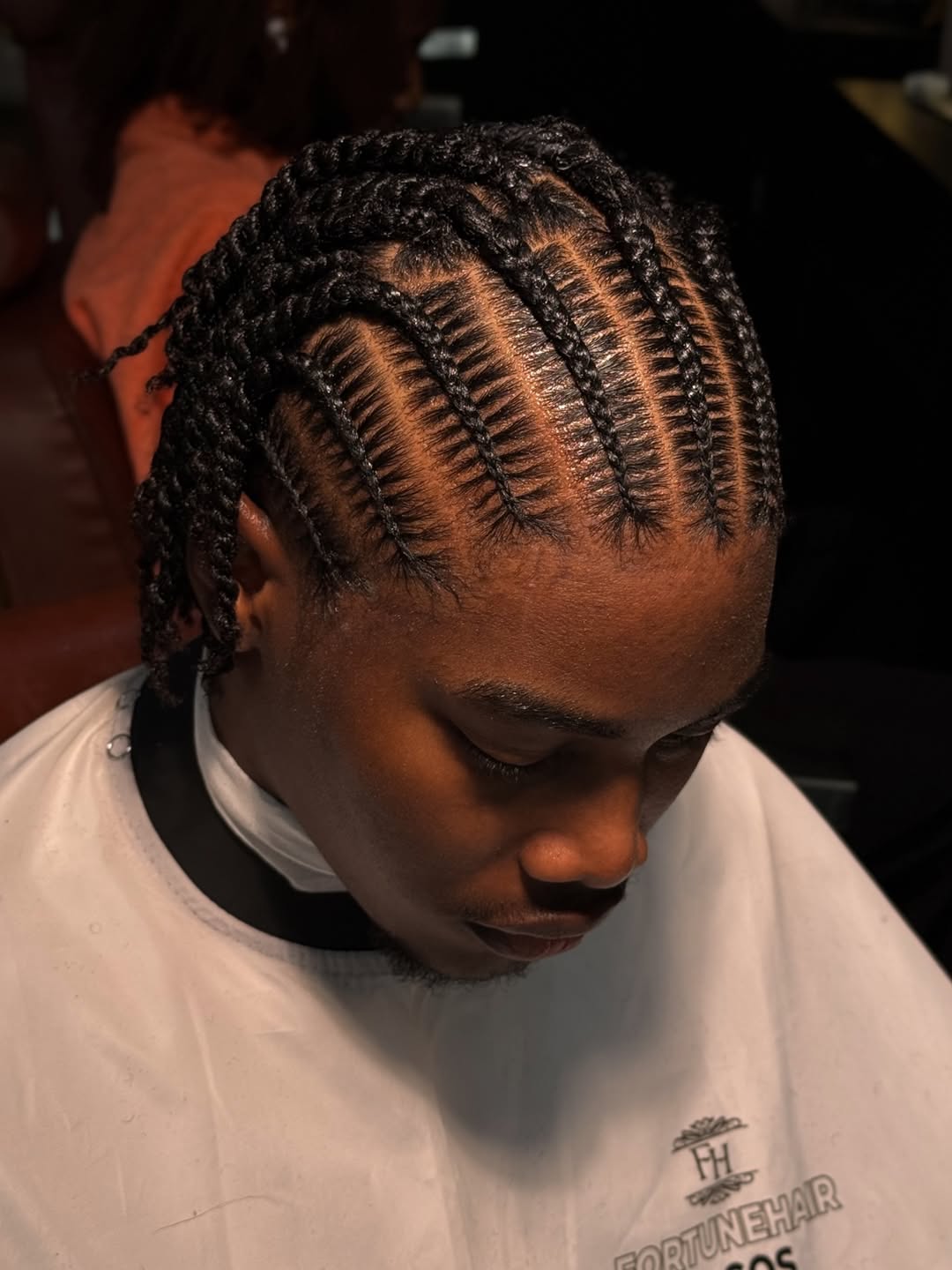Black cornrows with twisted ends, medium length, by Ani Braids in Lanham, Maryland