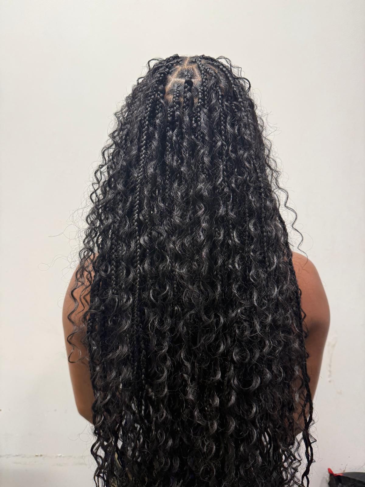 Long black boho knotless braids, waist-length, by Ani Braids in Lanham, Maryland