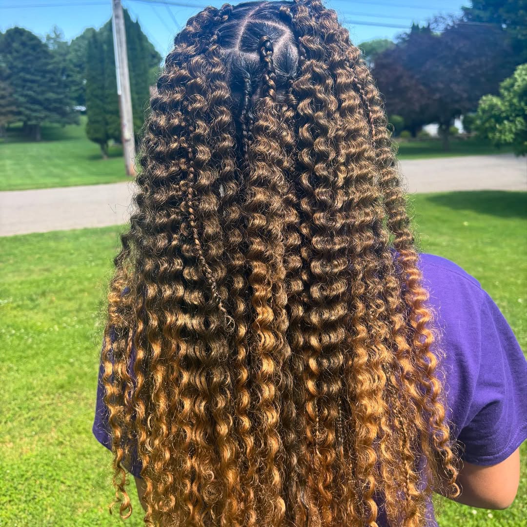 Long brown and honey blonde bohemian knotless braids by Ani Braids in Lanham, Maryland