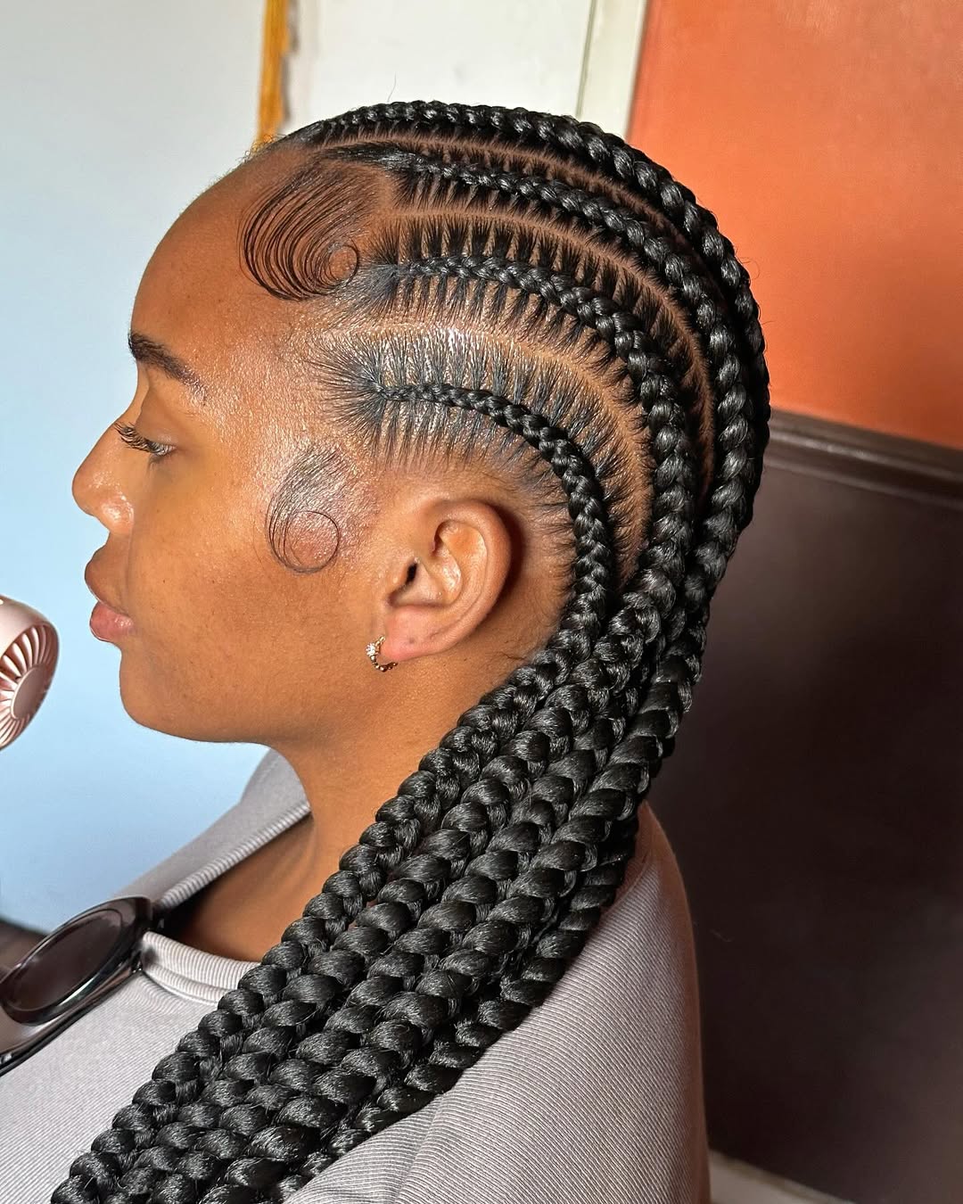 Long black cornrows with detailed baby hairs by Ani Braids in Lanham, Maryland