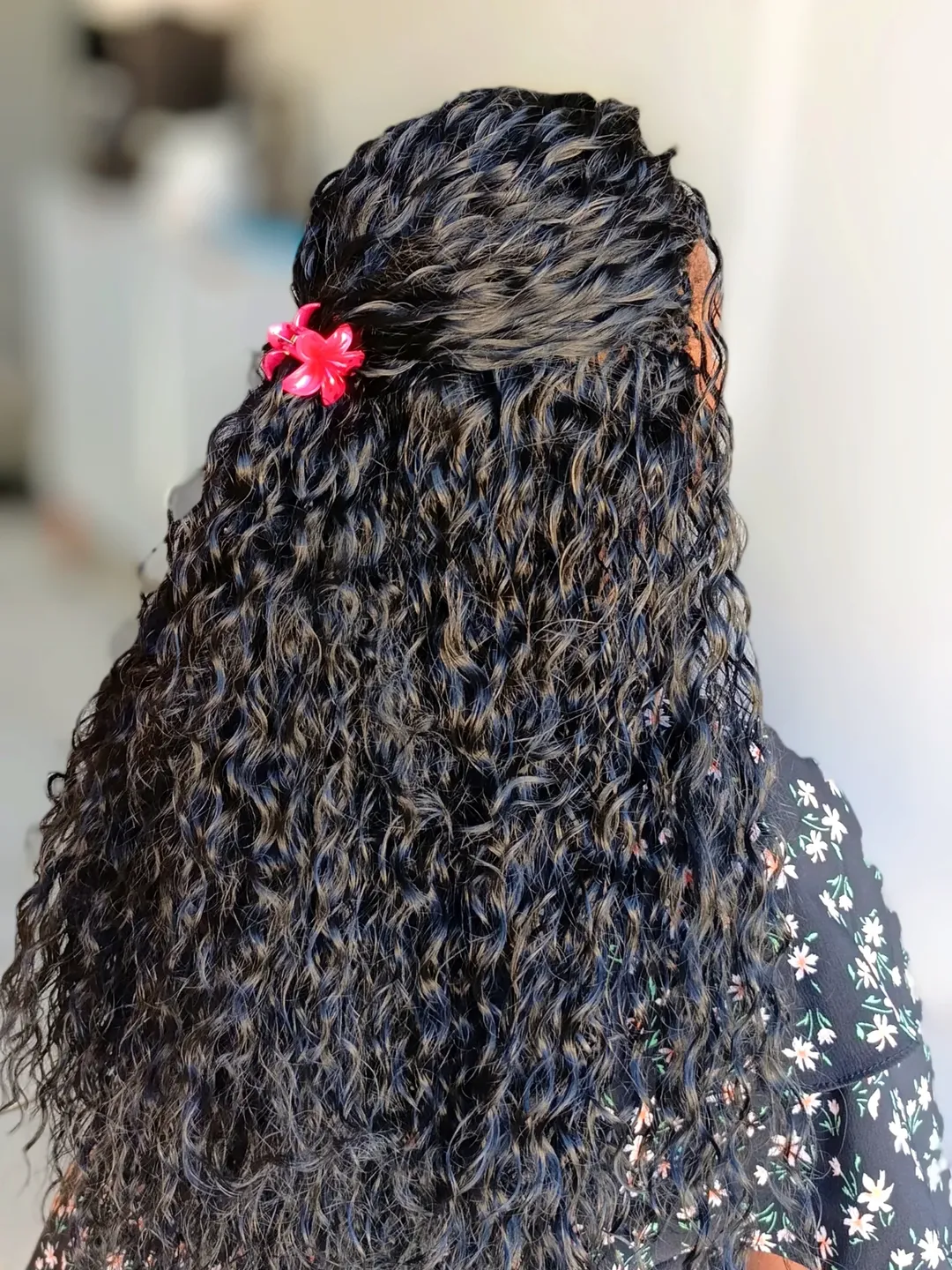 Half-up crochet style with long dark deep-wave curls by Ani Braids in Lanham, Maryland