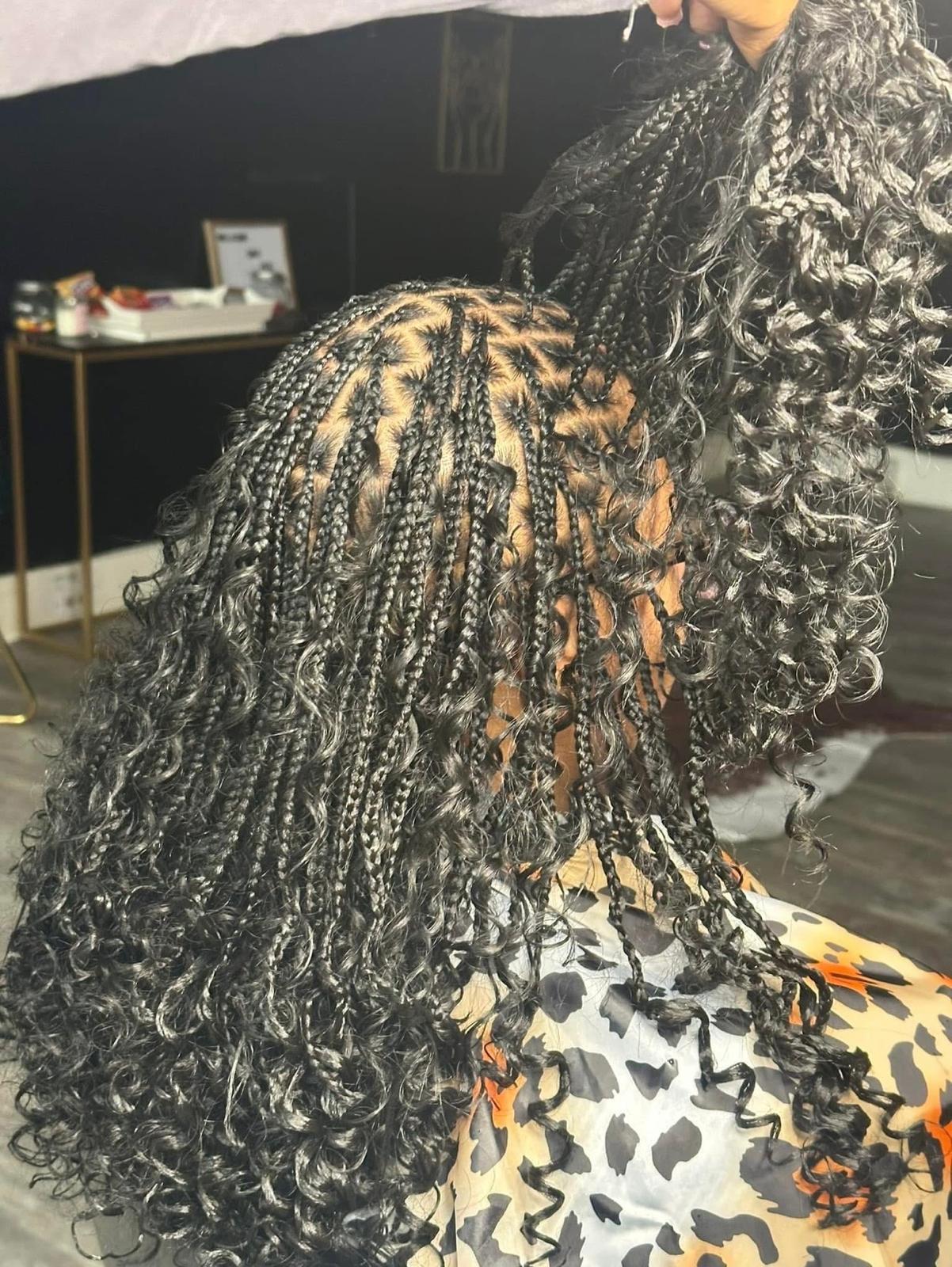 Black knotless boho braids with curly ends, medium length, by Ani Braids in Lanham, Maryland