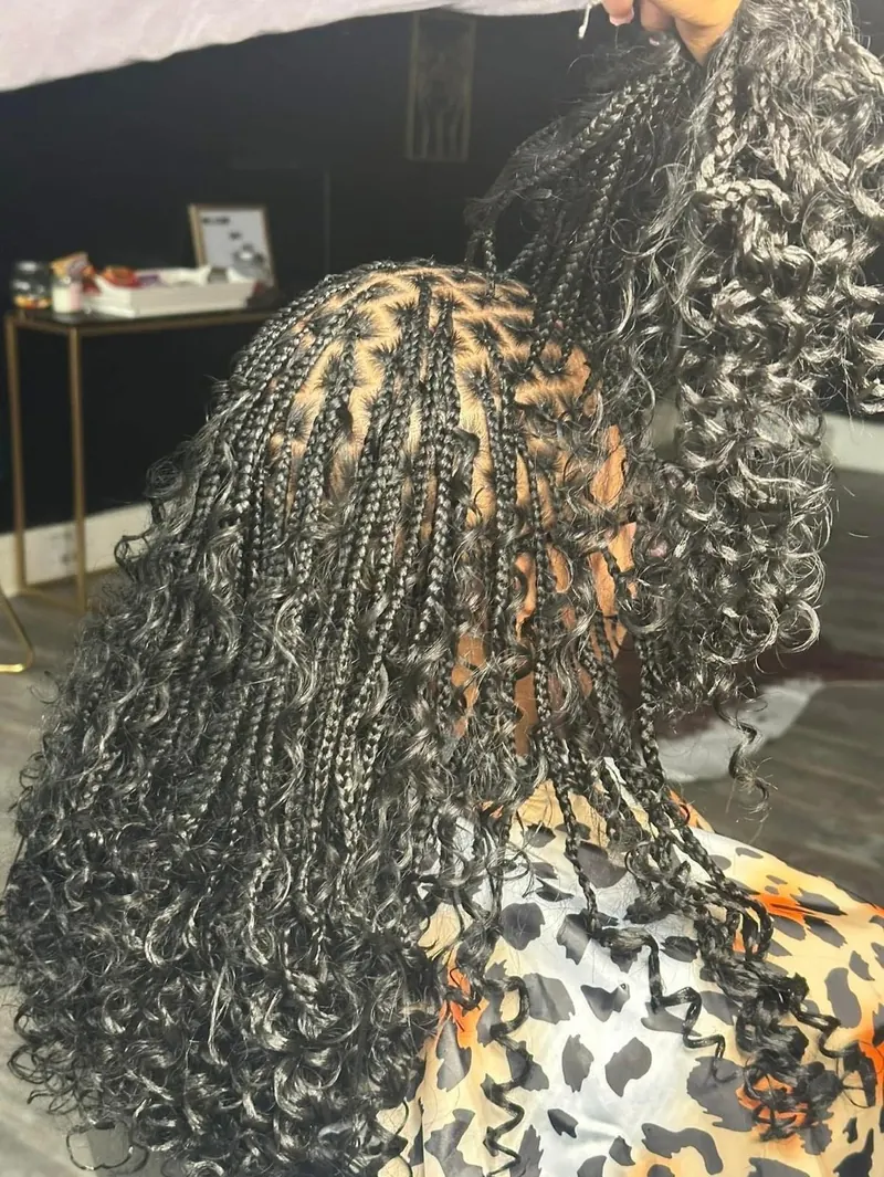 Black knotless boho braids with curly ends, medium length, by Ani Braids in Lanham, Maryland