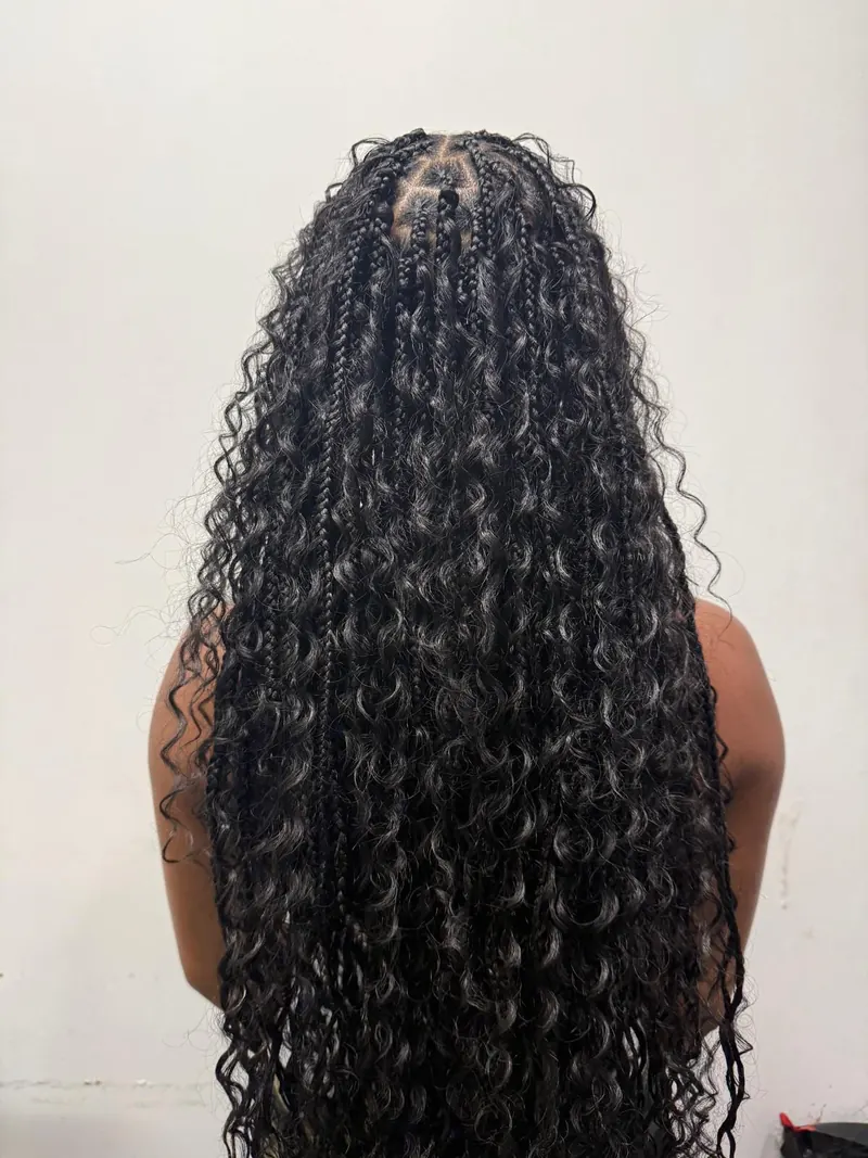 Long black boho knotless braids, waist-length, by Ani Braids in Lanham, Maryland