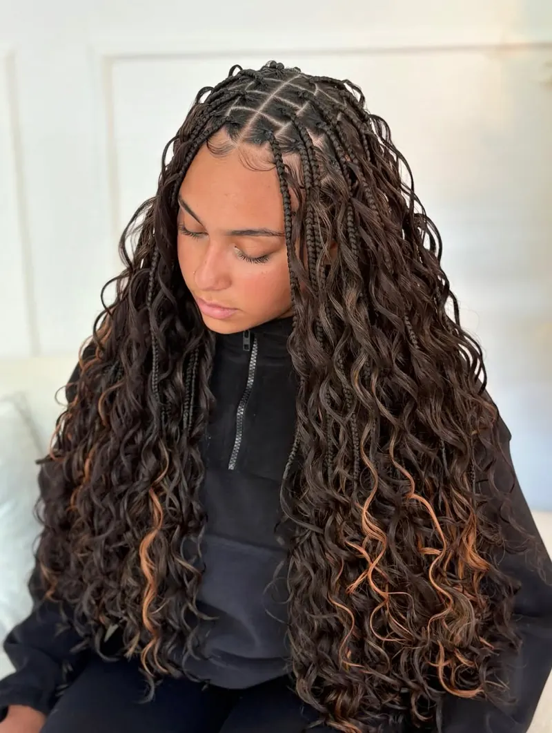 Long dark boho braids with wavy ends and light brown highlights by Ani Braids in Lanham, Maryland