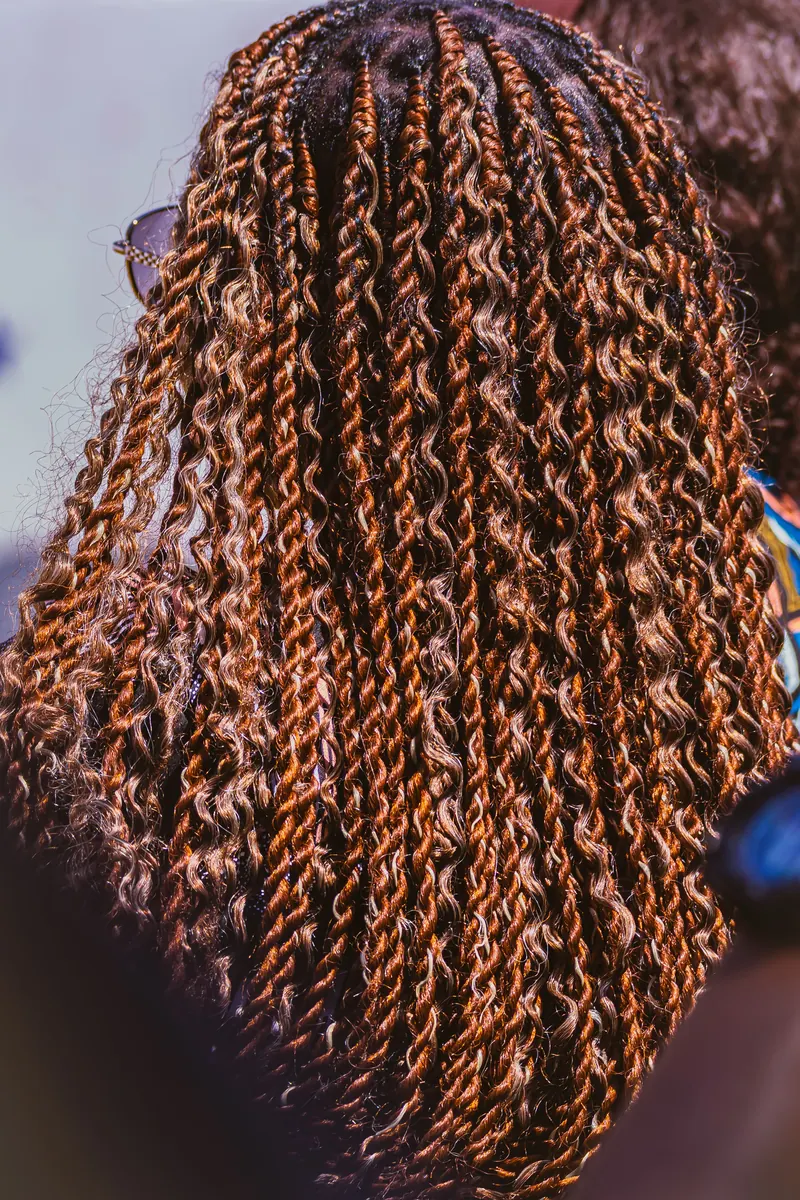 Close-up detail of neat, textured knotless braids