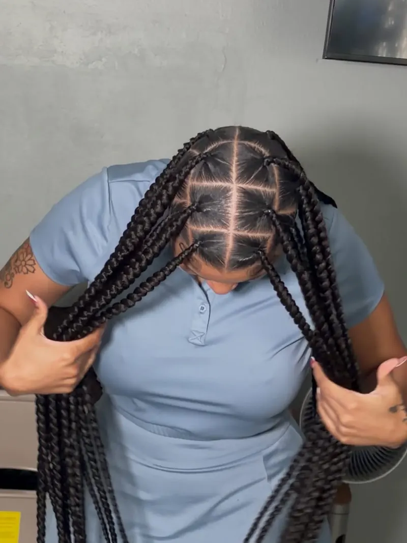 Top-down view of chunky knotless braids showing neat square parting across the scalp, installed at Ani Braids in Lanham, Maryland