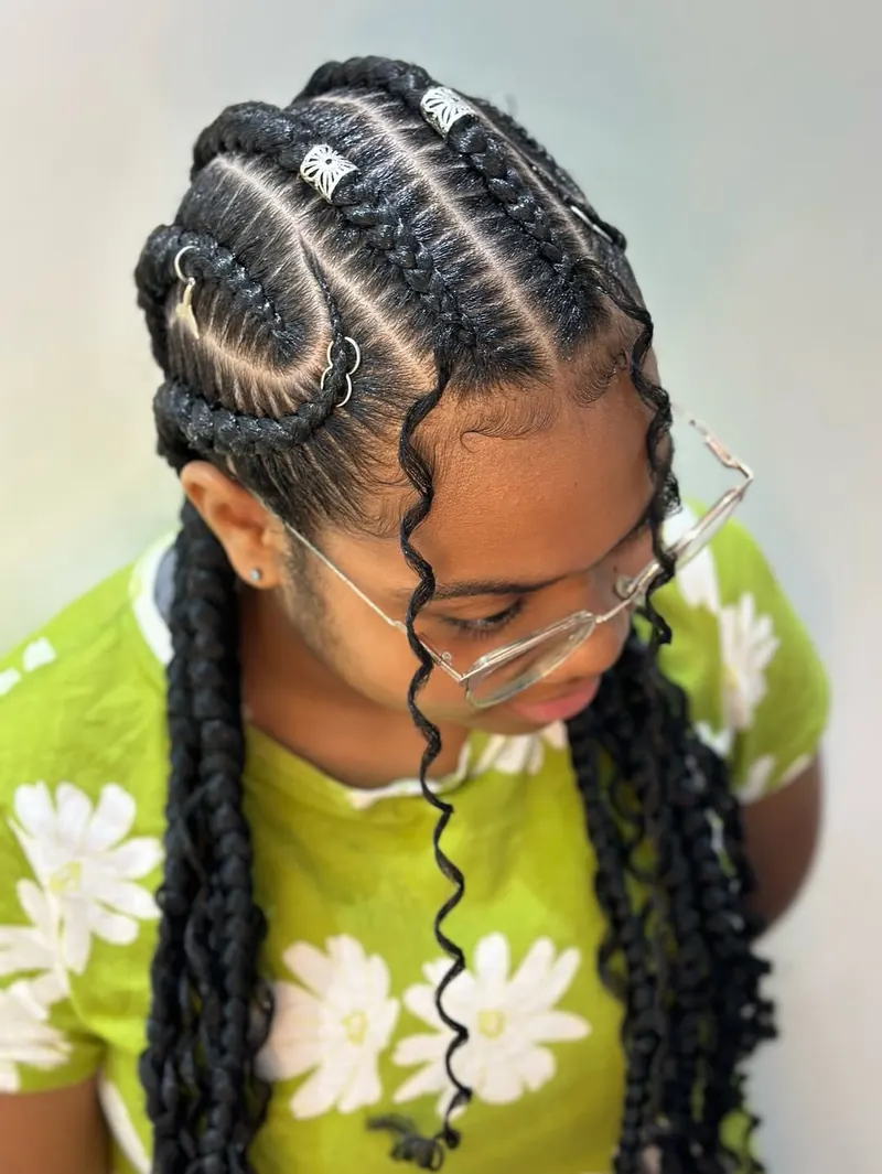 Cornrowed twists with silver hair rings in long black hair by Ani Braids in Lanham, Maryland